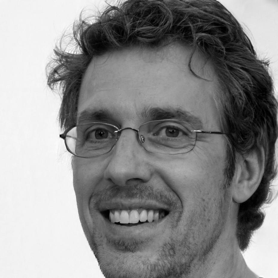 Professional headshot of male financial instructor
